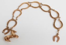 A 9ct gold bracelet made up of horseshoe links with 9ct gold horse charm, 19.1g