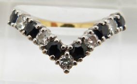 An 18ct gold ring set with sapphires and diamonds in a V shaped setting, 3.3g, size N