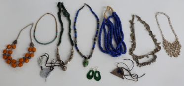A collection of beaded necklaces including glass, white metal Eastern jewellery, glass beads, etc