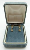 A pair of 18ct gold earrings set with a diamond to each measuring approx 0.15ct