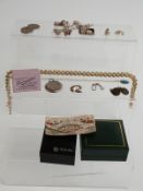 A pair of Japanese cufflinks, a silver compact (Birmingham 1918), a silver charm bracelet. a