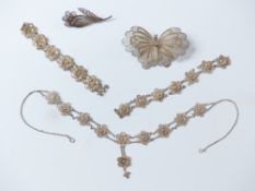 A filigree brooch, filigree necklace and a filigree butterfly brooch