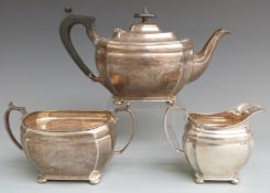 George V hallmarked silver three piece teaset of bulbous design with incuse corners, Sheffield