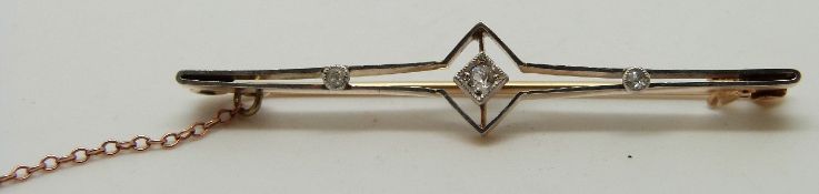 Victorian brooch set with three diamonds in a platinum setting, in original box