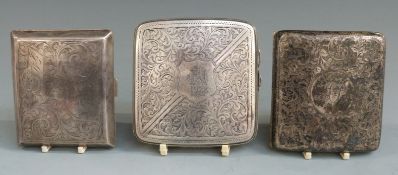 Three early to mid 20thC hallmarked cigarette cases with engraved decoration, each approximately 8.