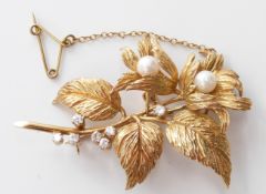An 18ct gold brooch in the form of a flower set with pearls and diamonds, 13.4g, width 5.5cm x
