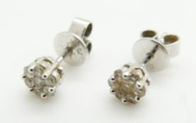 A pair of 18ct white gold earrings set with diamonds in clusters