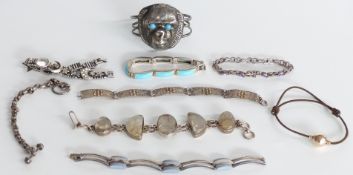 A silver bracelet set with quartz, four silver bracelets, a filigree bracelet etc
