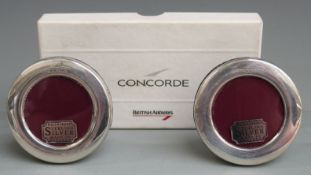 Boxed pair of Concorde hallmarked silver circular photograph frames, with easel backs, overall