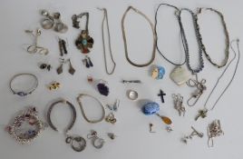 A collection of silver jewellery including rings set with agate, silver earrings, silver necklace