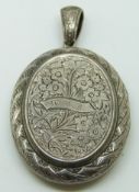 Victorian silver locket with engraved floral decoration verso ivy decoration