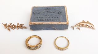 A 9ct gold dolphin brooch (0.9g), yellow metal and seed pearl brooch and an 18ct gold ring set