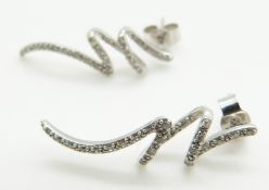 A pair of 9ct white gold earrings set with diamonds
