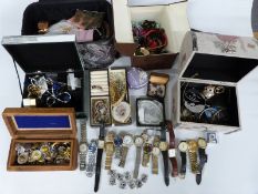 A large collection of costume jewellery including rings, brooches, watches, silver locket, beads,