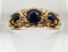 An 18ct gold ring set with sapphires and diamonds, 3.5g, size K