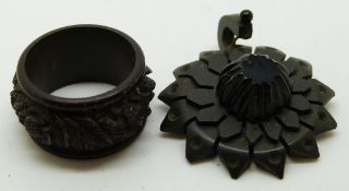 A volcanite pendant and a Victorian  carved jet ring