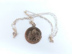 A 9ct gold St. Christopher pendant on chain with millennium hallmarks, 1.7g