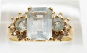 An 18ct gold ring set with aquamarines and white sapphires, 4.9g, size T