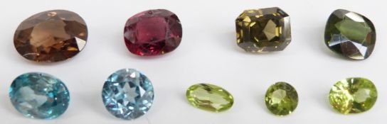Nine cut gemstones including tourmaline, garnet, quartz, peridot and zircon
