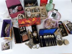 A large collection of costume jewellery including necklaces, brooches etc