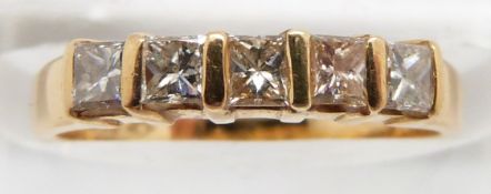An 18ct gold ring set with five princess cut diamonds, 2.3g, size H