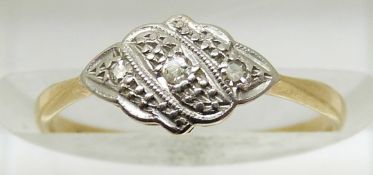 An 18ct gold ring set with diamonds in a platinum setting, 1.4g, size J