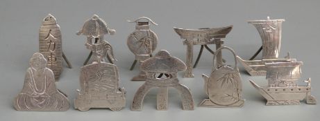 Set of ten Chinese or similar white metal menu or name holders, all formed as Eastern objects and