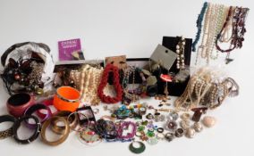 A collection of costume jewellery including glass pendants, beads, etc