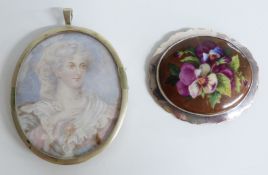 A silver brooch set with a painted plaque depicting a pansy and a miniature painting on ivory in a