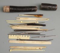 19thC sewing set in card tubular case, comprising needles, hooks etc, length of case 20cm