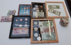 A collection of UK and overseas coinage, some in frames, together with some banknotes including