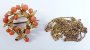 A yellow metal pendant/brooch set with coral beads in a textured foliate wreath, 7.4g (3 x 3.2cm)