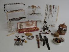 A collection of costume jewellery including brooches, silver earrings, Miracle brooch, necklaces,