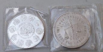 Two Mexican one ounce silver coins