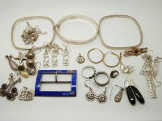 Three silver bangles, silver earrings, a pair of yellow metal earrings, a 9ct gold brooch (1.4g),