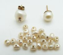 Two pearl earrings, one set with a diamond and loose pearls