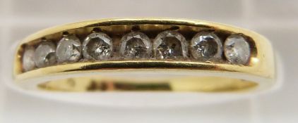 An 18ct gold half eternity ring set with diamonds, 2.7g, size K
