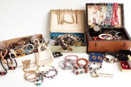 A collection of costume jewellery including bangles, beads, etc