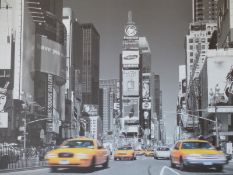 A large print of New York in silver frame.