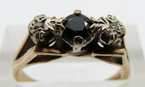 A 9ct gold ring set with a sapphire and diamonds, 3.3g, size N
