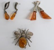A pair of silver earrings set with pressed amber, a novelty insect brooch set with pressed amber etc