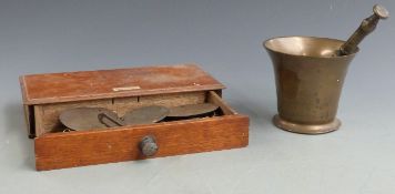 A set of weights and scales by May Roberts & Co, London, with box, together with a bronze pestle and