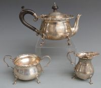 George V hallmarked silver three piece teaset with shaped rim raised on pad feet, Sheffield 1917