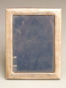 Modern hallmarked silver photograph frame to suit 7x5 inch photo, with velvet easel back,