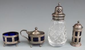 George V hallmarked silver three piece cruet set with blue glass liners, Sheffield 1921/2 maker
