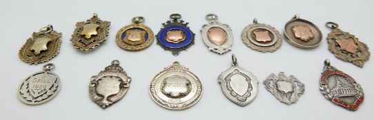 A collection of fobs including five hallmarked silver with rose gold detail, hallmarked silver