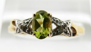 A 9ct gold ring set with peridot and diamonds, 1.6g, size P