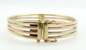 A 9ct tri-coloured bangle, 19.9g, 6 x 5.3cm