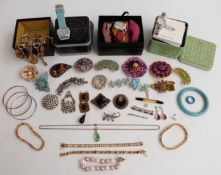 A collection of costume jewellery including vintage brooches, Art Deco brooch, silver bracelets,