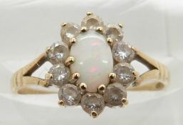 A 9ct gold opal ring with diamond surround, 1.5g, size K